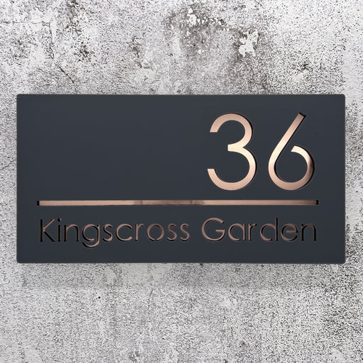 laser cut house number sign with rose gold mirror text