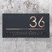 laser cut house number sign with rose gold mirror text