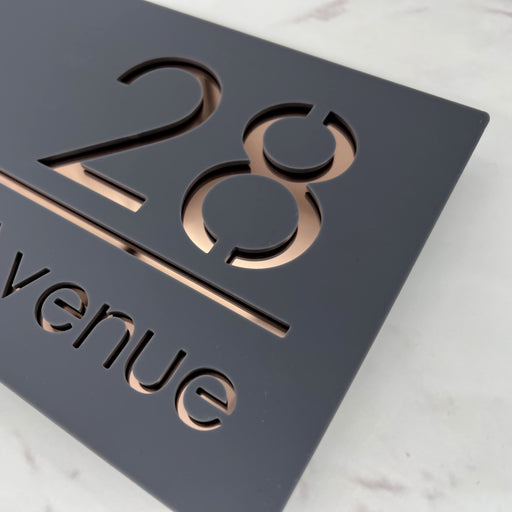 laser cut house number sign with rose gold mirror text