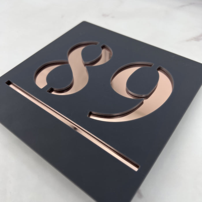 square laser cut house sign with shiny rose gold mirror text