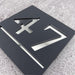 square laser cut house number sign with silver mirror text