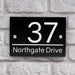 house number sign in high black gloss