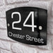 round curve house number sign in high black gloss